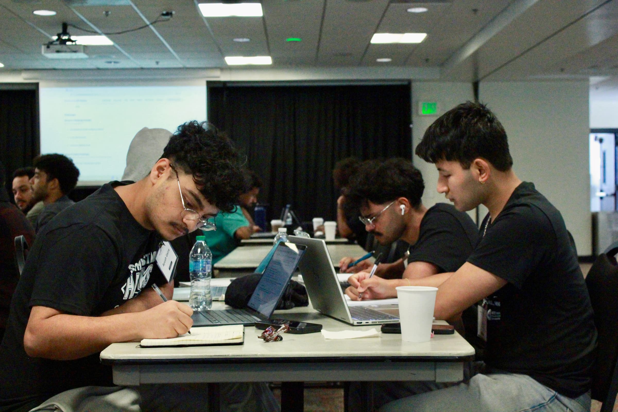 A team collaborating overnight at Southwest MN Hacks: Fall 2026