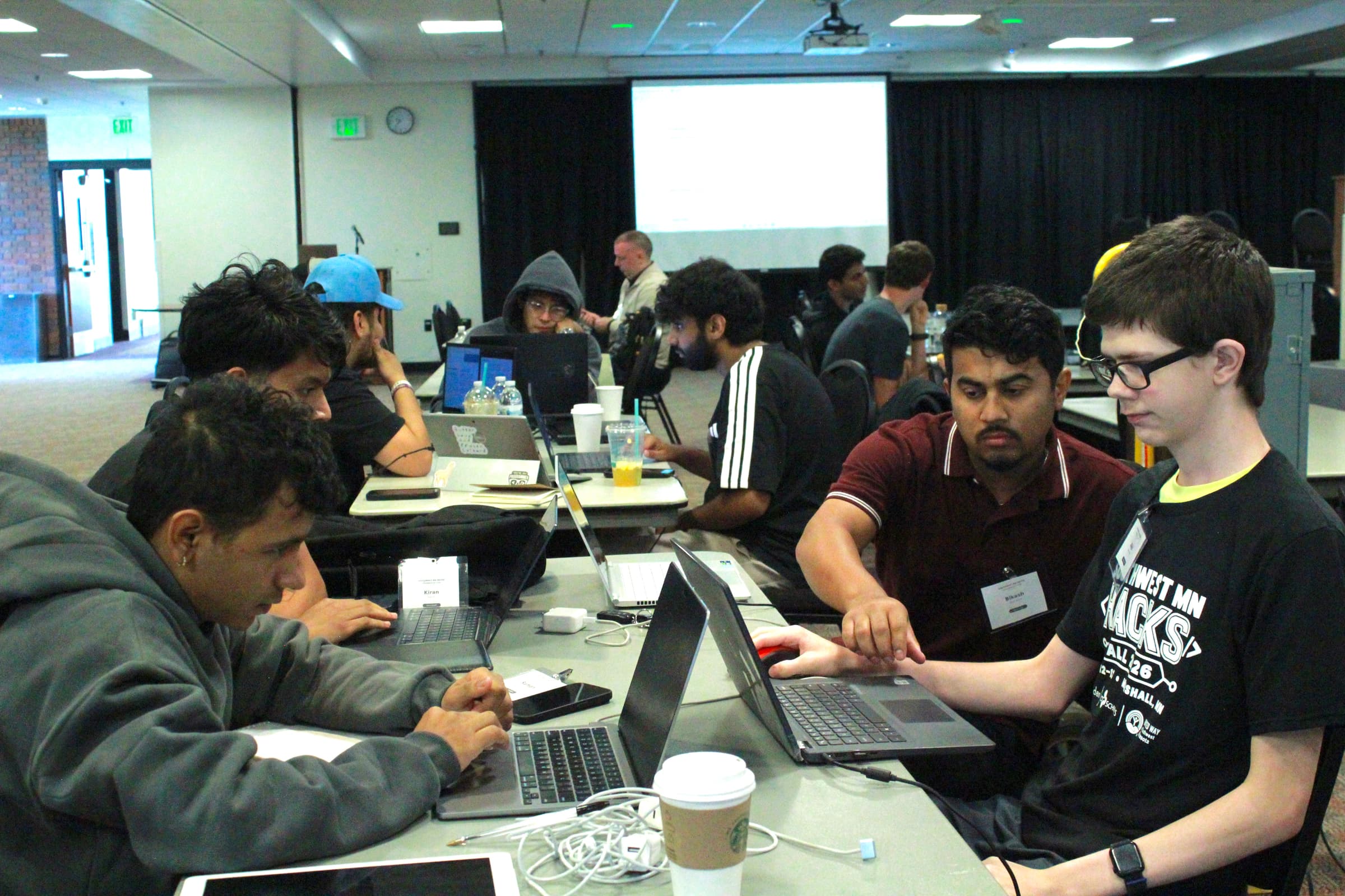 Teams at work overnight at Southwest MN Hacks: Fall 2026